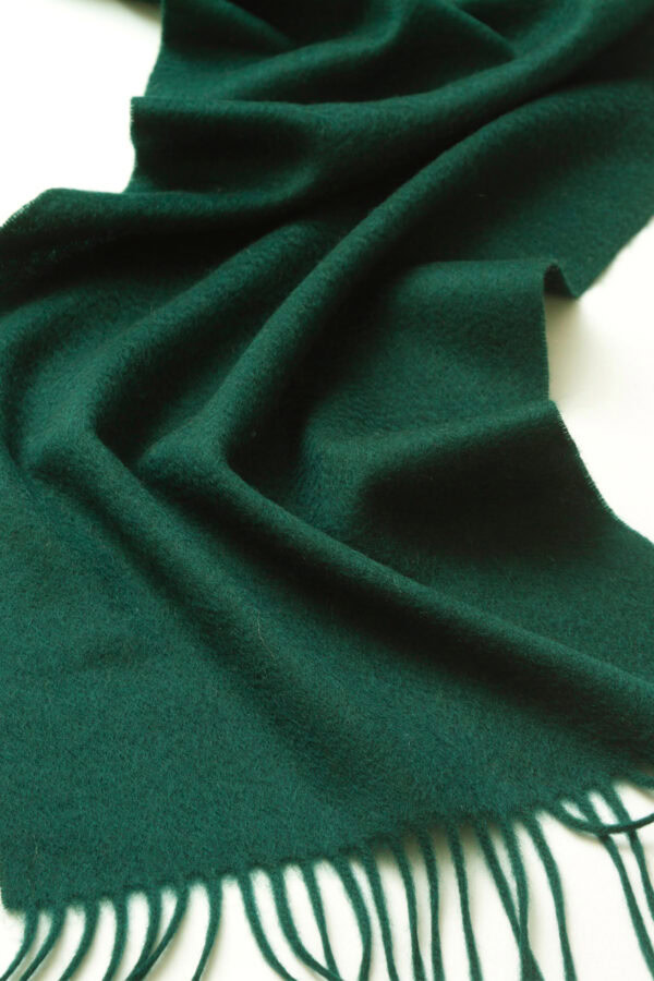 Details of dark green cashmere scarf