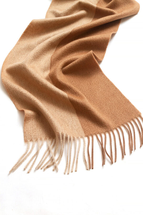 Detailed view of the plaid pattern on the brown and coffee cashmere scarf